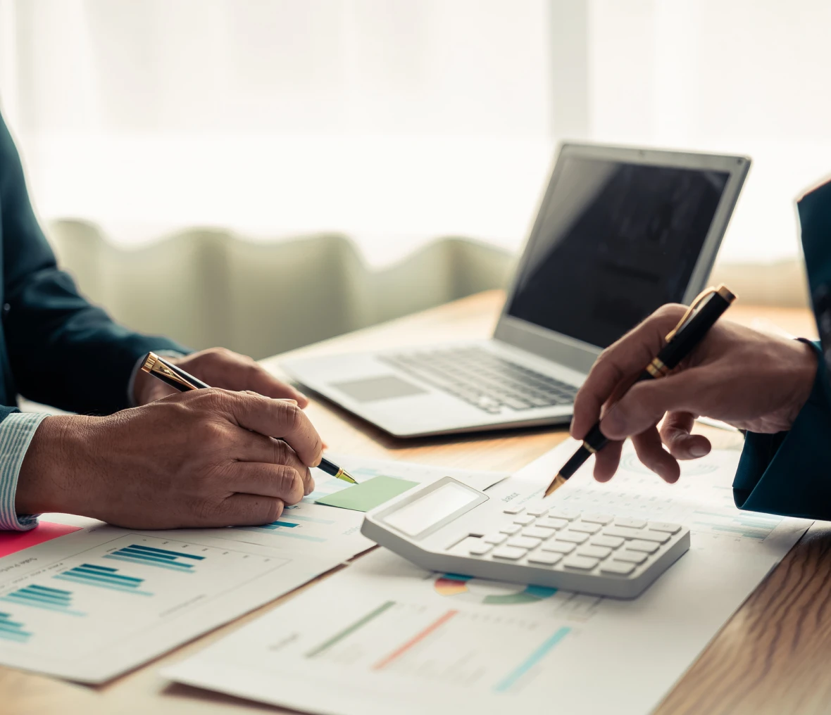 Business meeting with charts and calculator